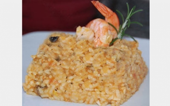 Arroz meloso con langostinos y rape